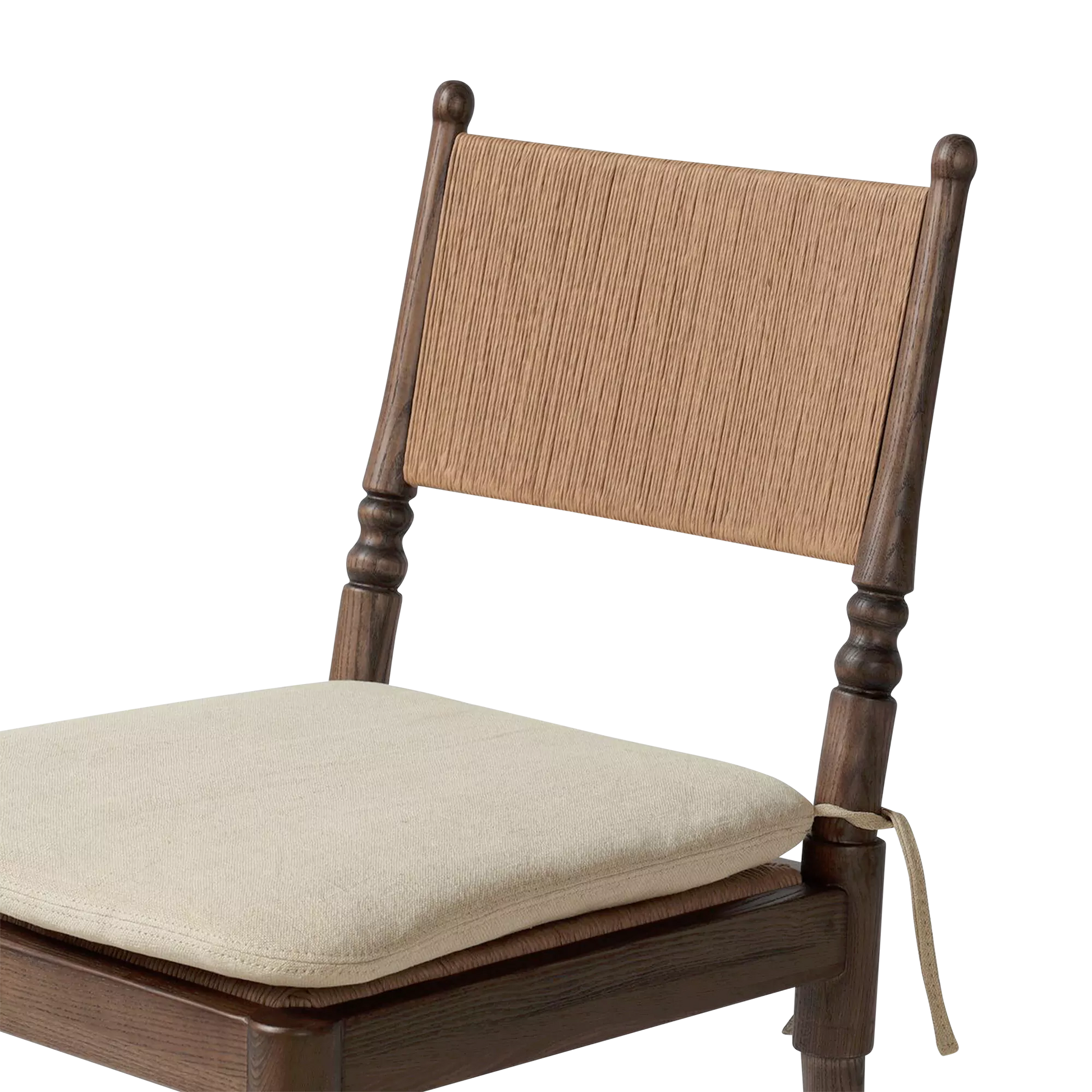 Close-up of chair back with woven material and wooden posts