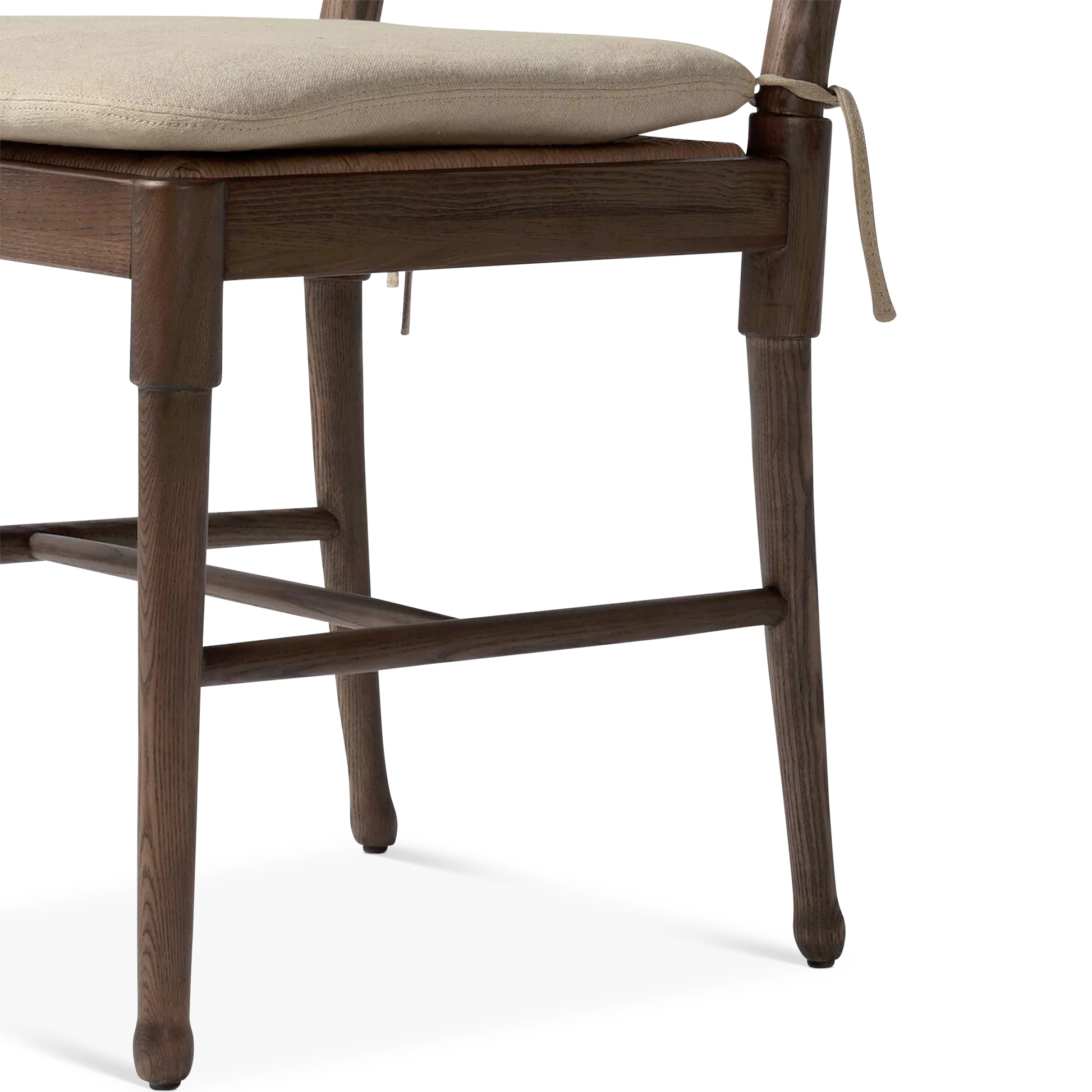Close-up of chair leg and supporting brace in wooden chair